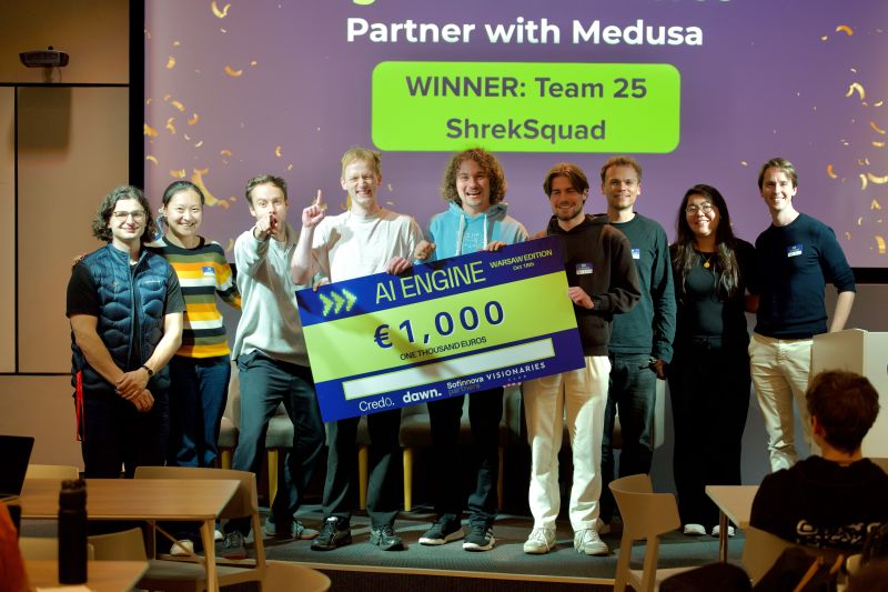 AI Engine winning team on stage with their prize